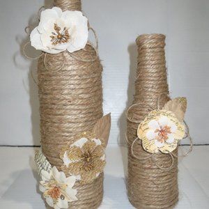 2 Jute wrapped wine bottles/vases. Burlap flowers.